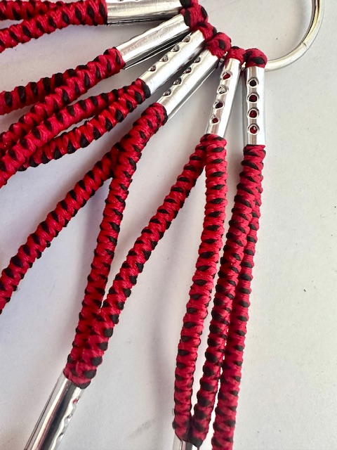 Cubrerueda, de goma, veteado en negro y rojo